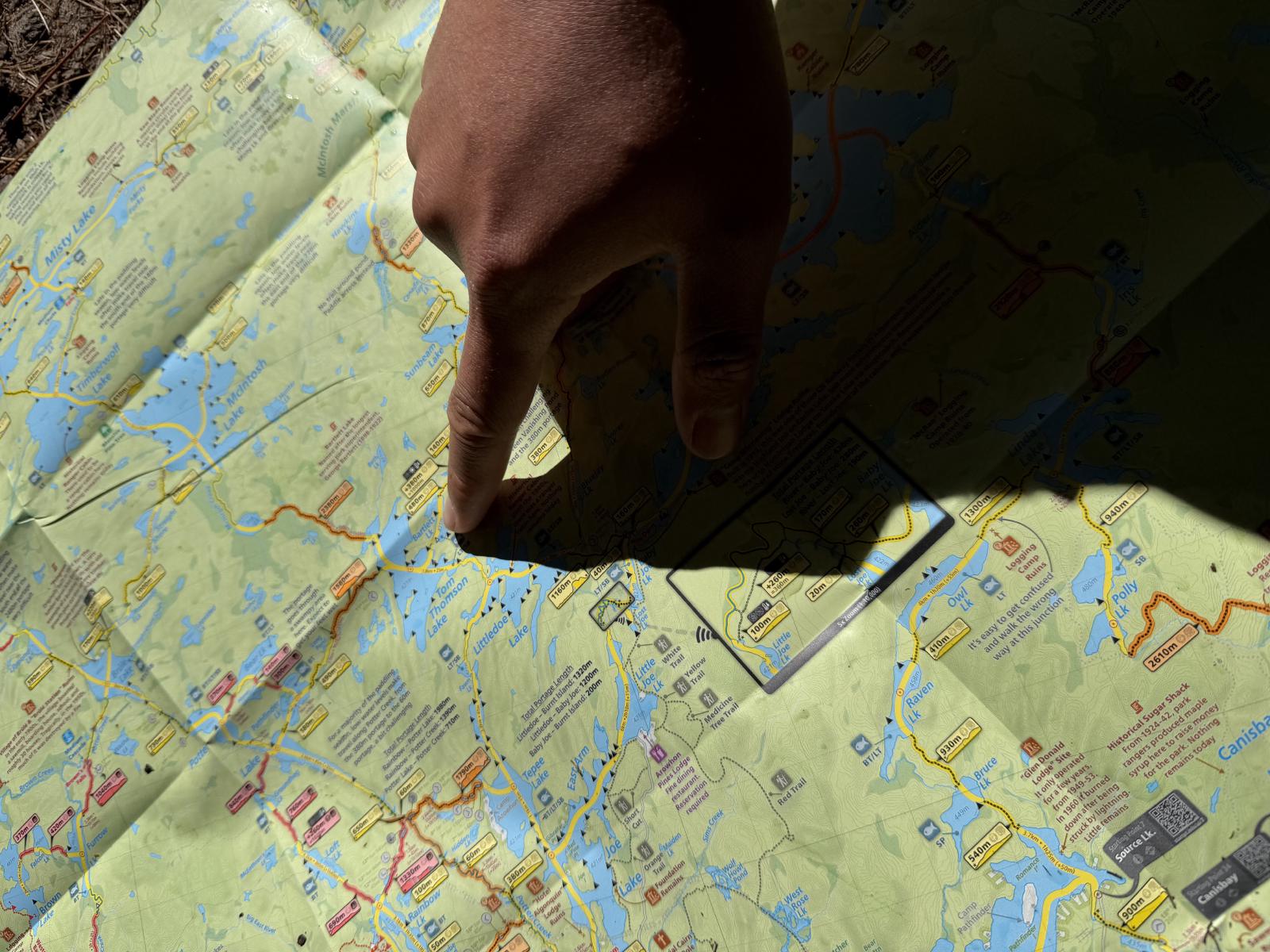 Our route planning session — Maps by Jeff on the table